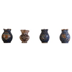 Four Italian majolica pitchers
