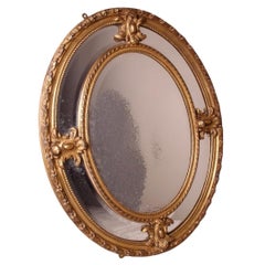 A Victorian Giltwood Oval Marginal Plate Mirror