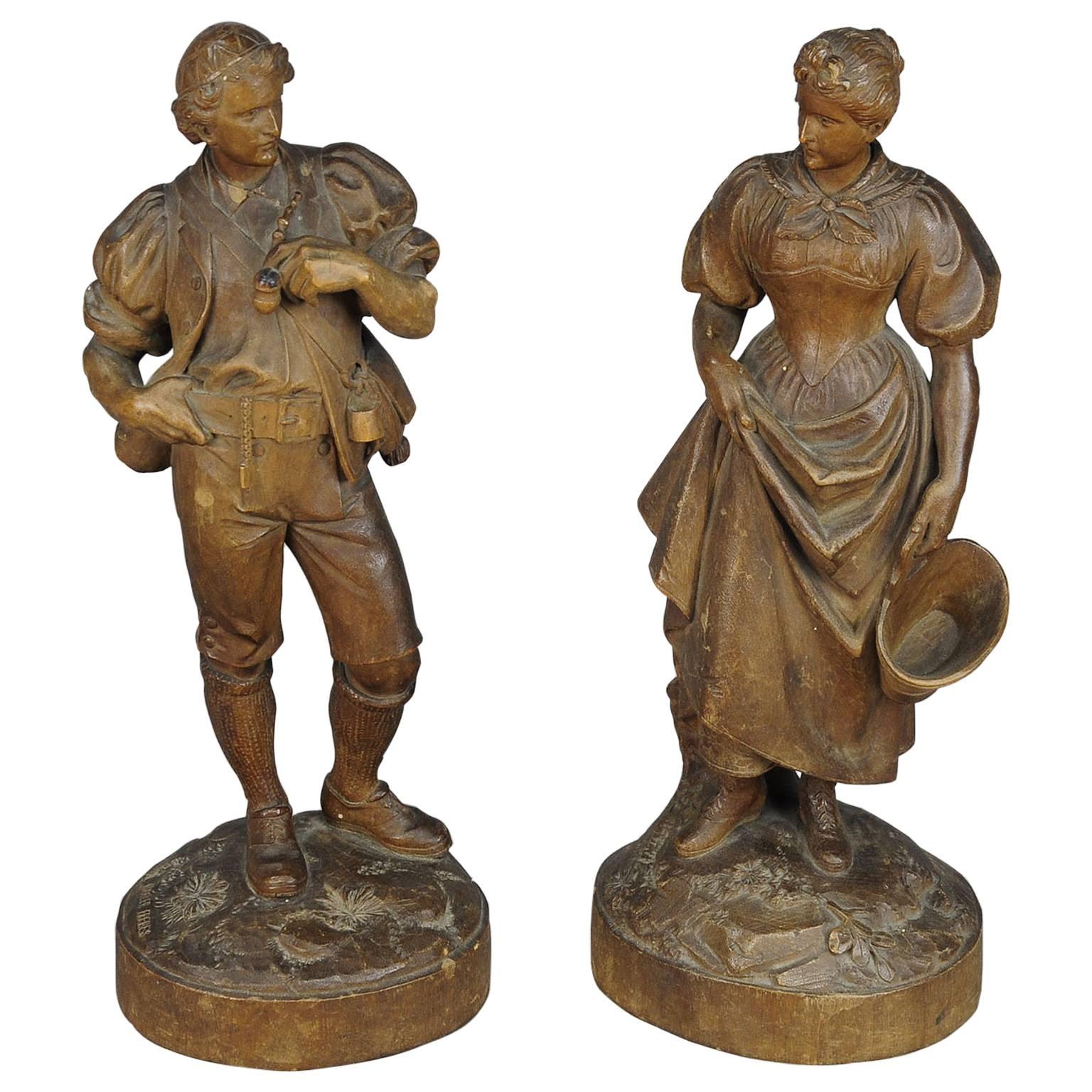 Expressive Carved Statues of a Maid and Farmer by Johann Huggler