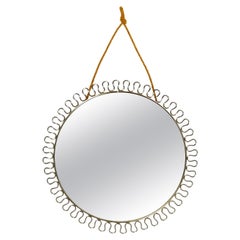 Beautiful small Mid Century metal wall mirror in bow design in gold color