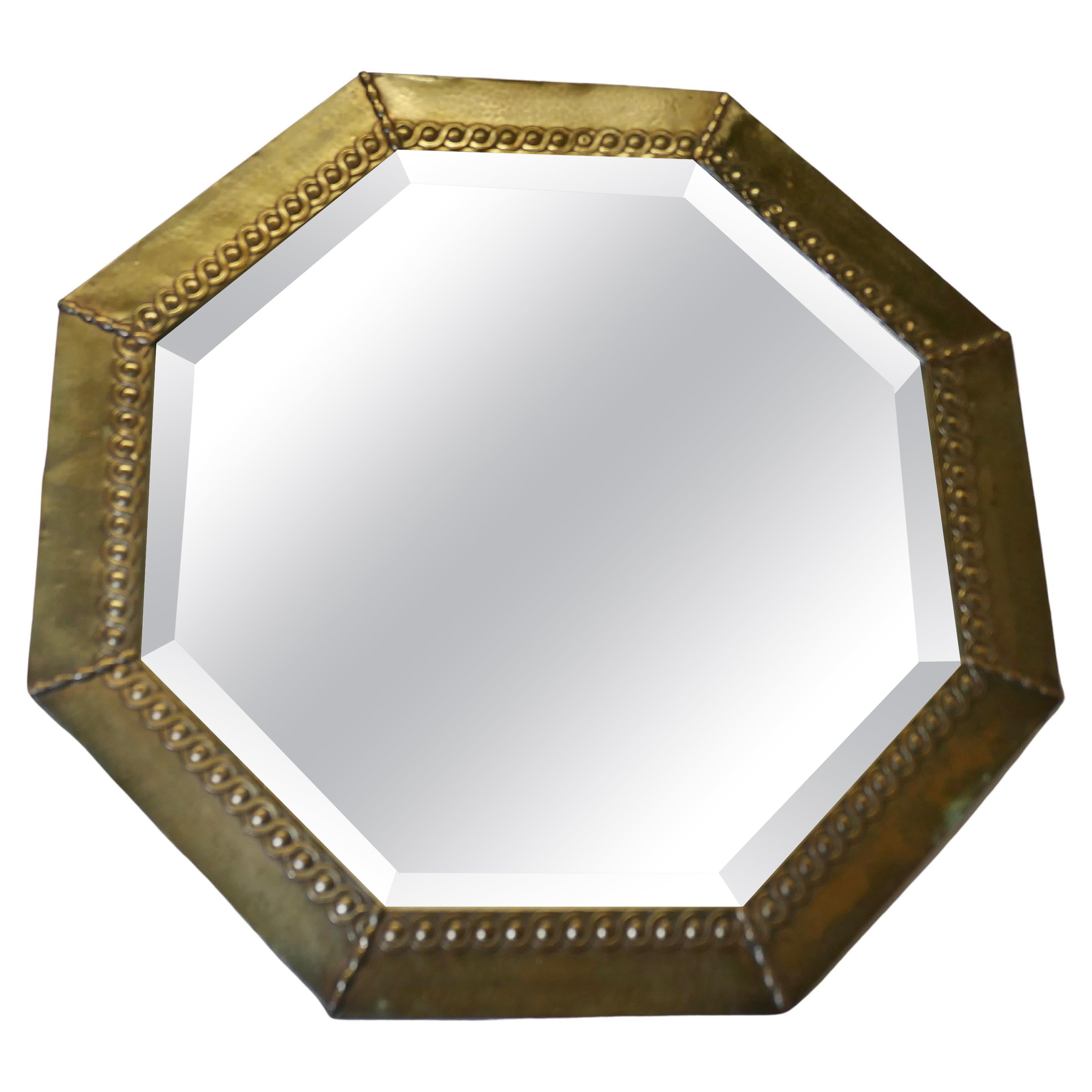 An Arts and Crafts Beaten Brass Mirror    This is a very stylish mirror