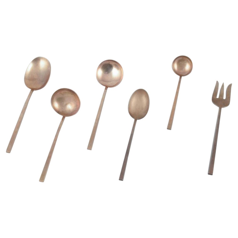 Sigvard Bernadotte "Scanline" brass flatware. Six pieces of serving utensils. For Sale