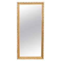 Mirror in a gold frame.