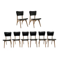 Conjunto de 8 sillas de comedor Early Vladimir Kagan. Nogal con cuero negro original.