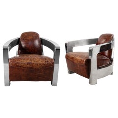 Paire de chaises longues de style Art déco en cuir et chrome