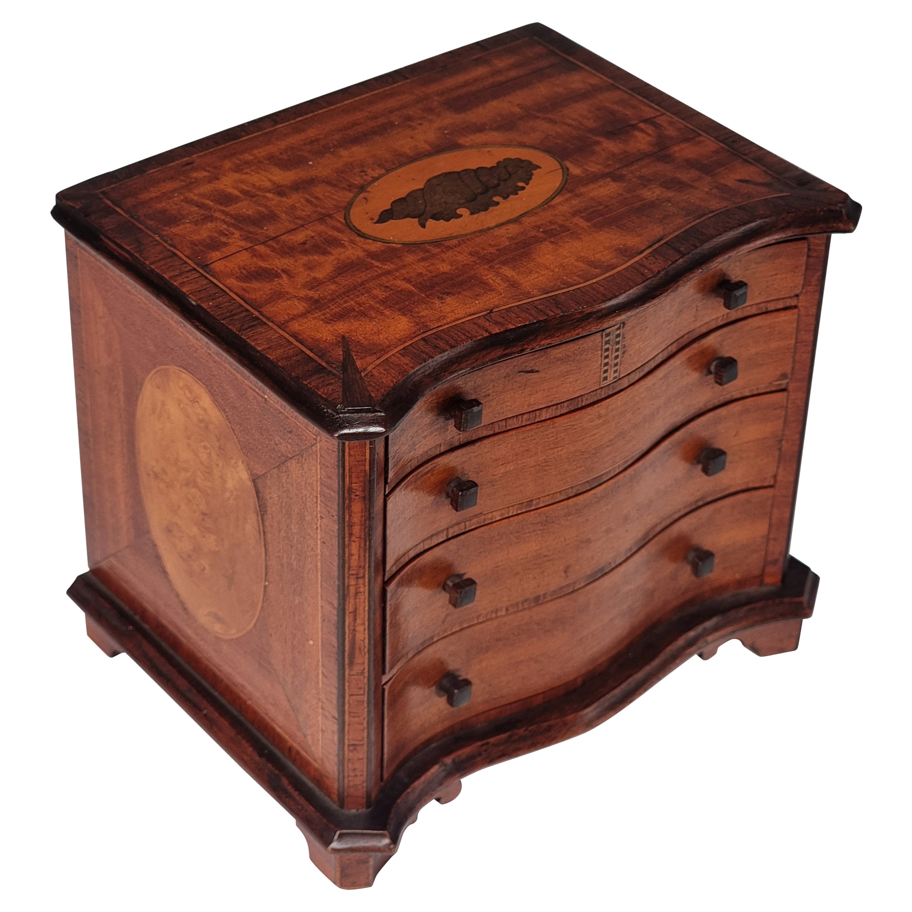 A miniature 18th C style mahogany English serpentine chest of drawers 1907