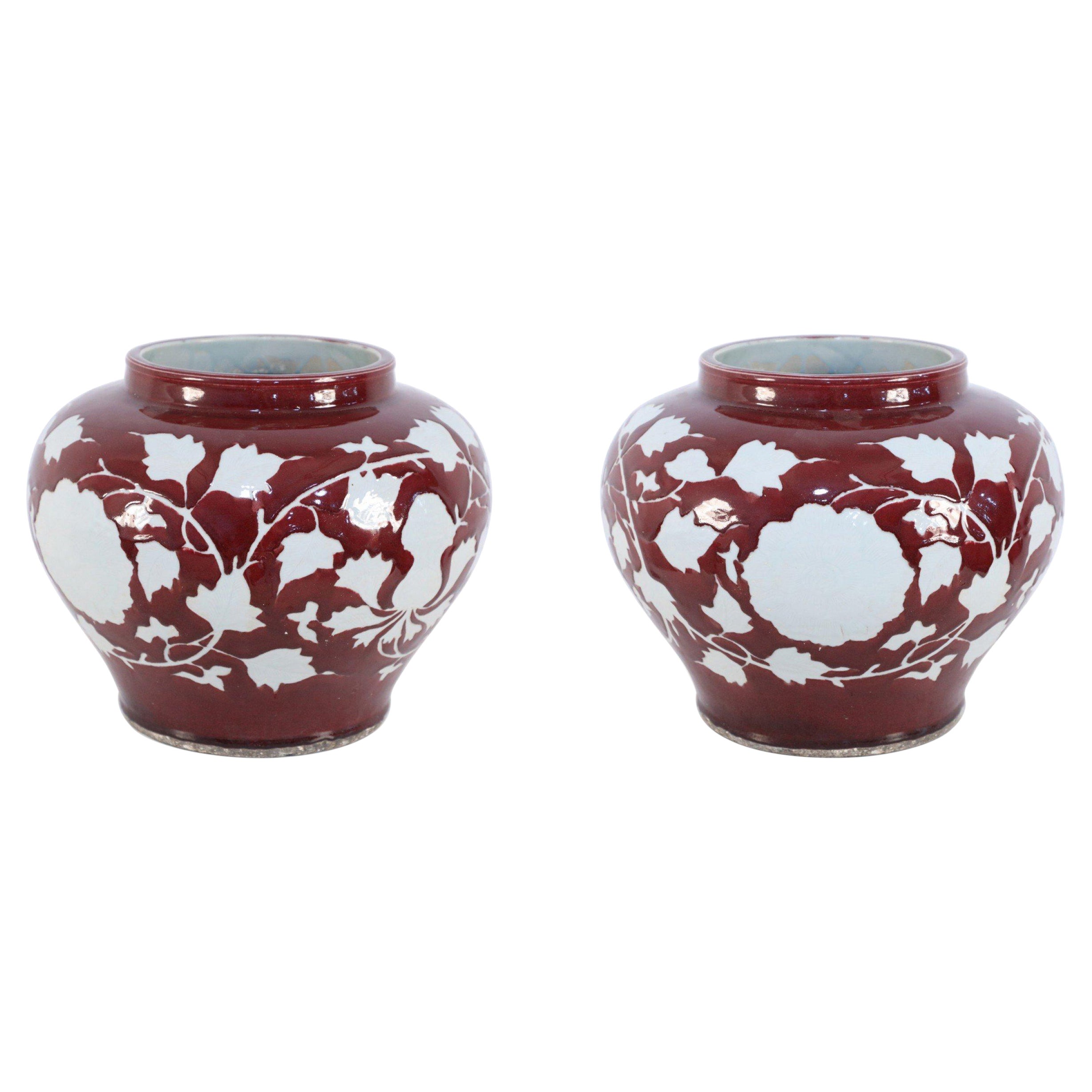 Pair of Chinese Burgundy and White Floral Motif Pots For Sale