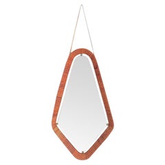 A lovely Italian 1950s rattan and brass framed mirror with leather hanging strap