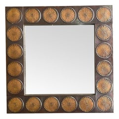 An Italian 1960s brass mirror by Santambrogio & De Berti