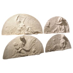 A Set of French Plaster Overdoors Depicting the Four Seasons
