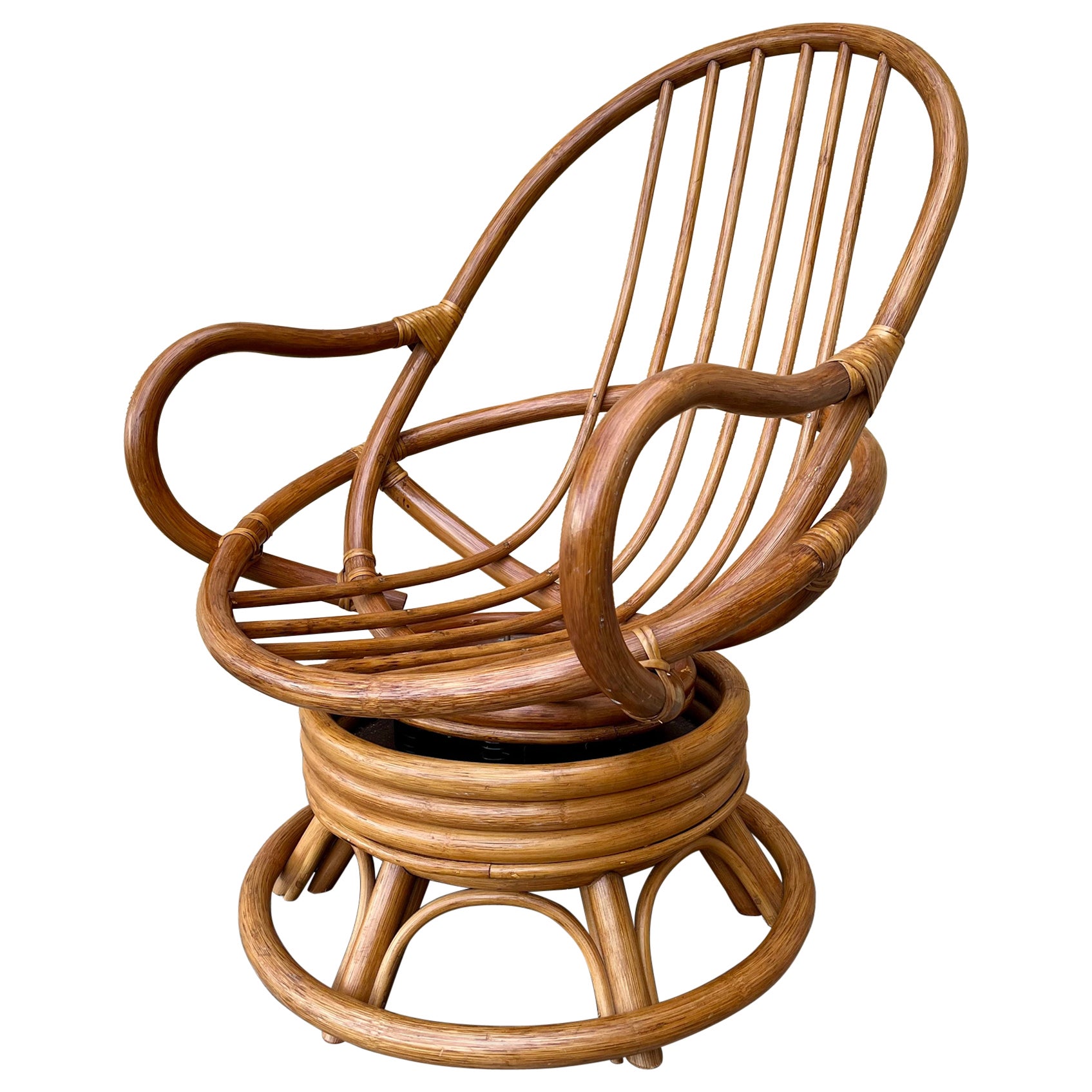 Boho Bent Rattan Swivel Lounge Chair in the Paul Frankl's Manner. Circa 1970s