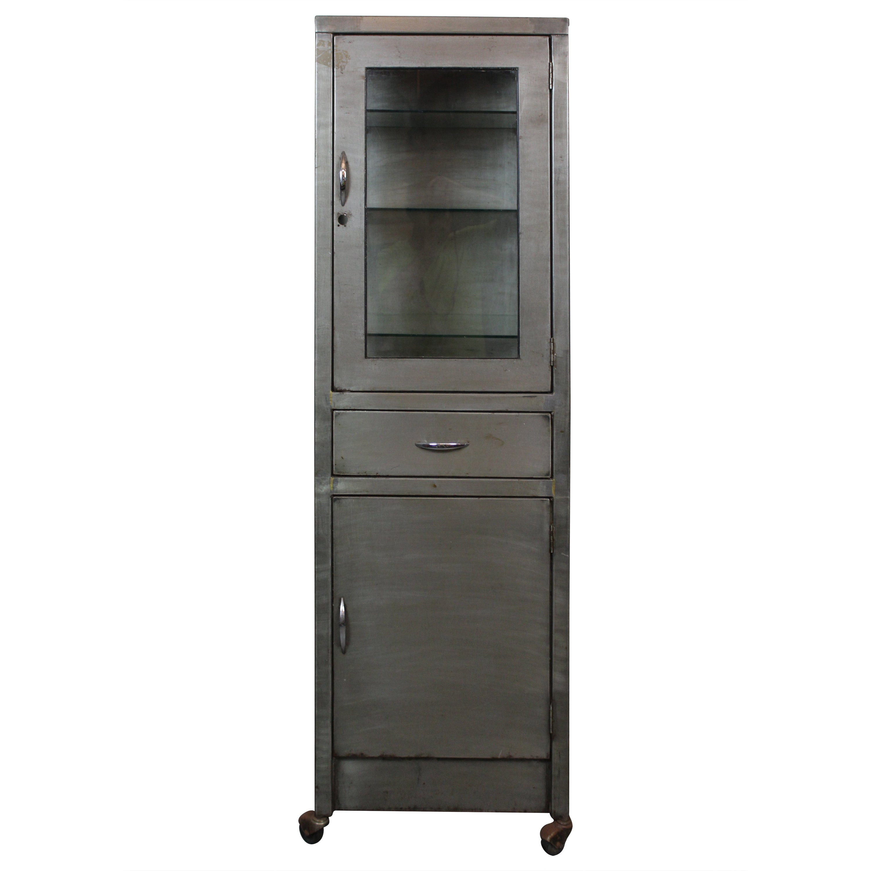 Add a splash of gritty presence into any space with this robust industrial metal cabinet, straight out of the machine age! Standing over 5 feet tall, this steel structure features a large windowed display cabinet with three adjustable glass shelves,
