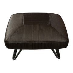 Pouf with a black square pillow and iron legs