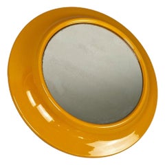 Italian modern round ocher yellow plastic mirror by Cattaneo Italy, 1980s