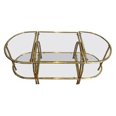Faux-bamboo-style brass tripartite coffee table in the style of Maison Baguès