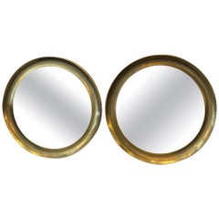 Pair Large concave brass frame circular mirrors