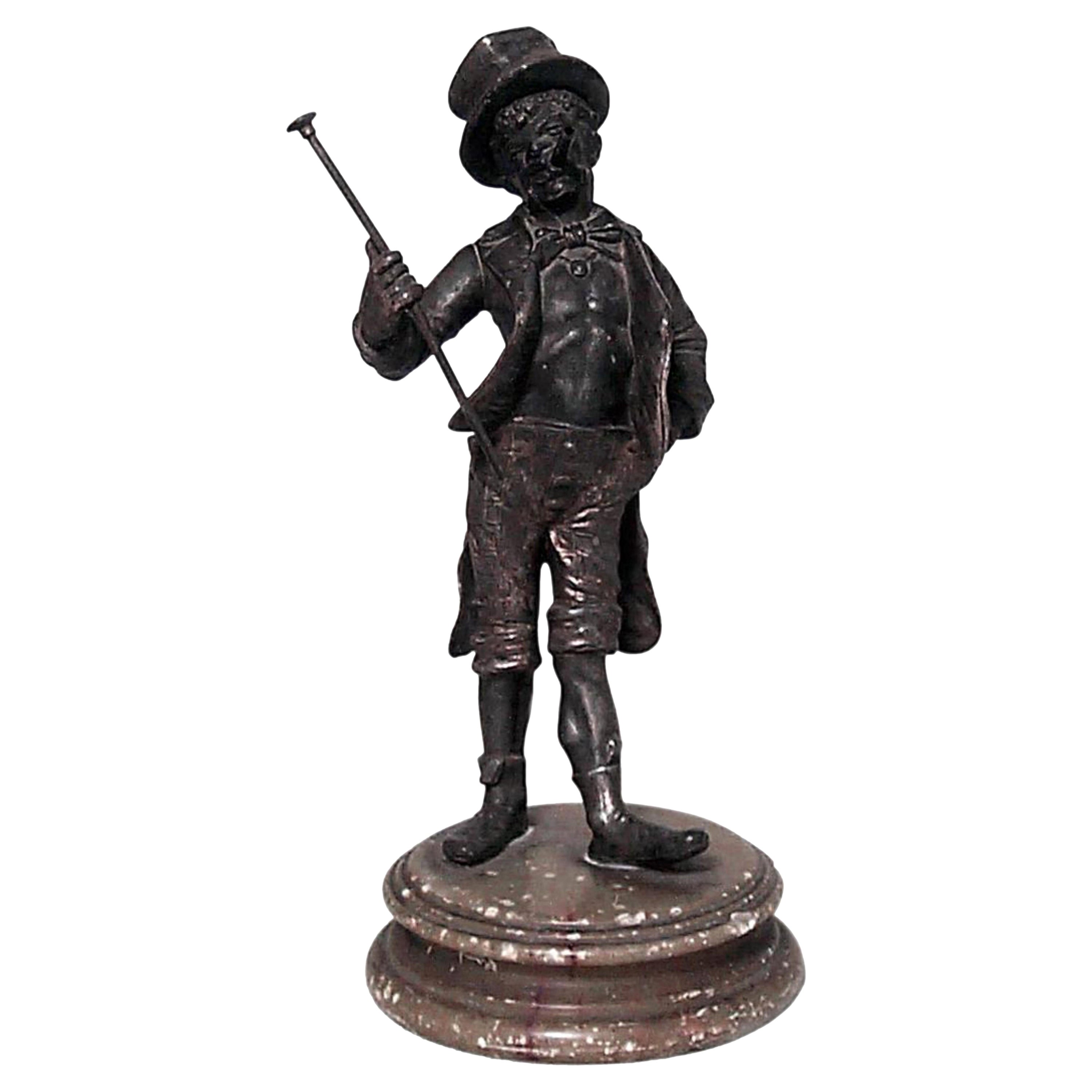 Figura de metal victoriana de hombre pavoneándose