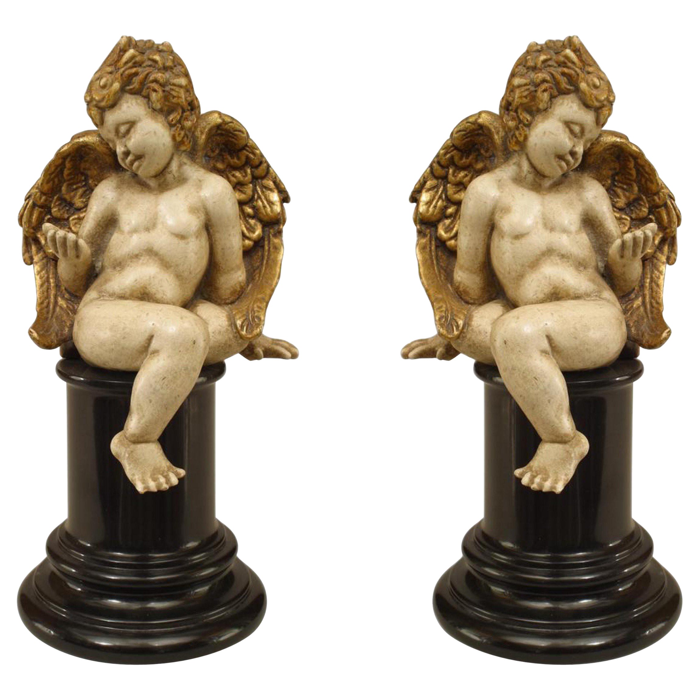 Pareja de cupidos italianos rococó dorados en venta