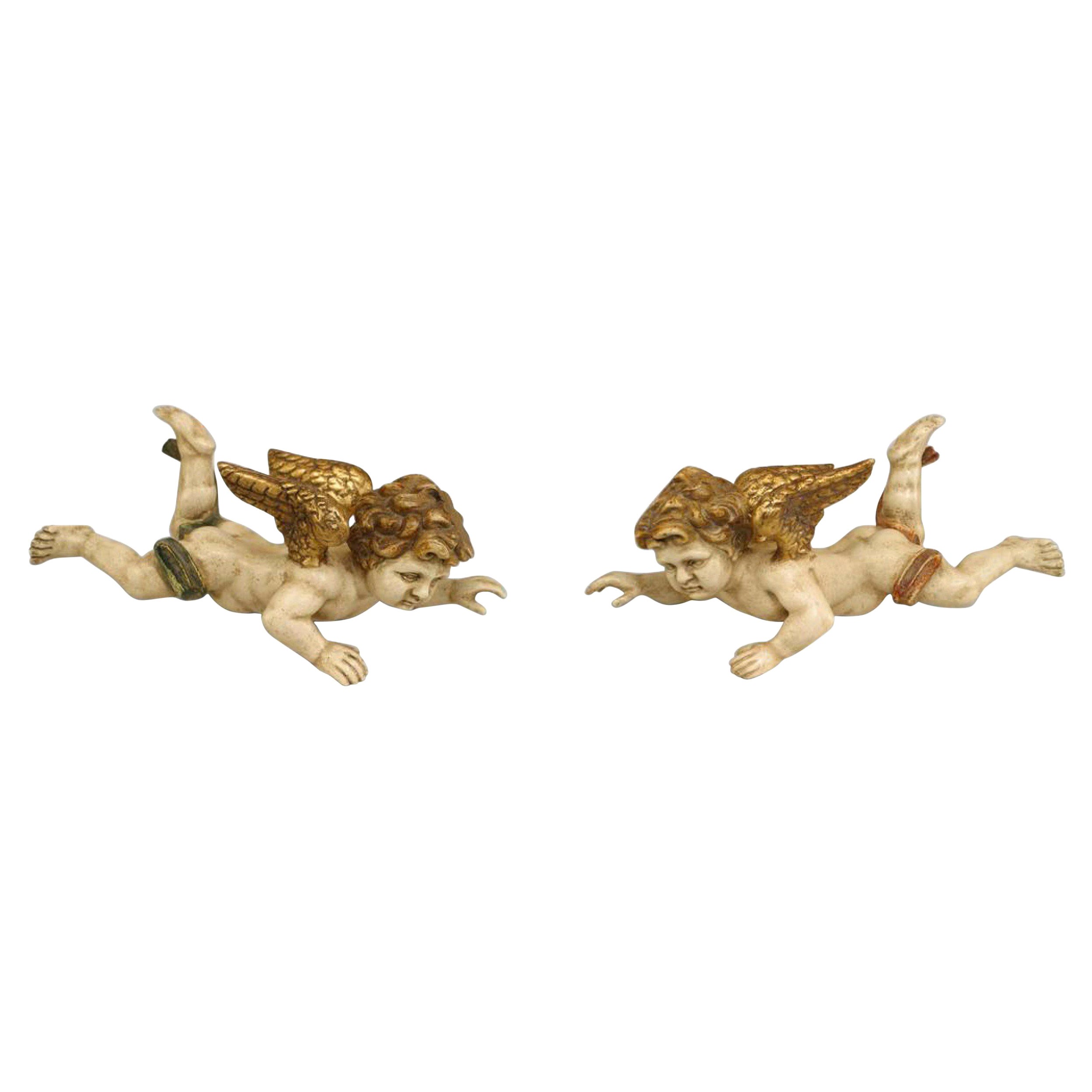 Pareja de cupidos italianos rococó dorados