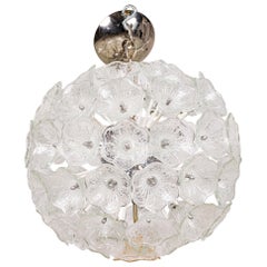 sphere shaped chandelier surrounded by textured Floral clear glass flowers