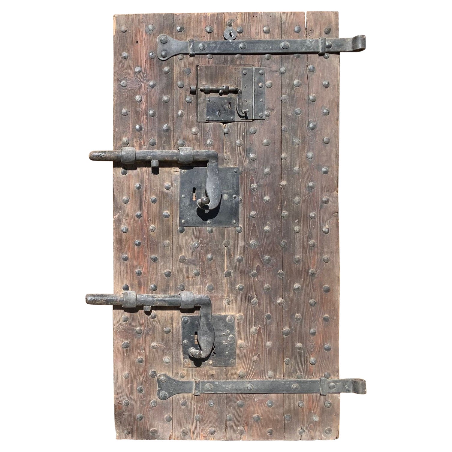 Wooden prison door with original studs and locks, Italy