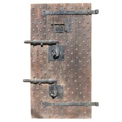 Antique Wooden prison door with original studs and locks, Italy