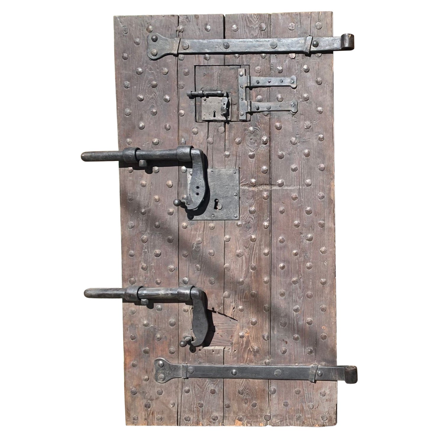 Wooden prison door with original studs and locks, Italy