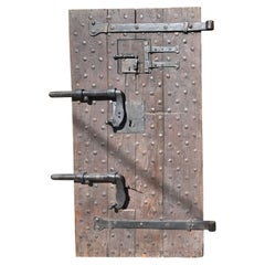 Antique Wooden prison door with original studs and locks, Italy