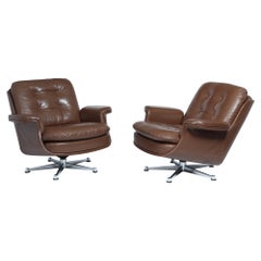 Pair of Mid Century leather Swivel Chairs