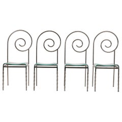 Set of 4 "Suspiral" chairs by Luigi Serafini