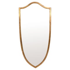 Grand miroir biseauté en forme de bouclier doré 57" H x 27" L