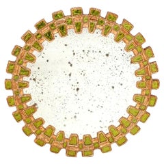 A Lime Green Glass Convex Mirror, in a "Tudor" design.