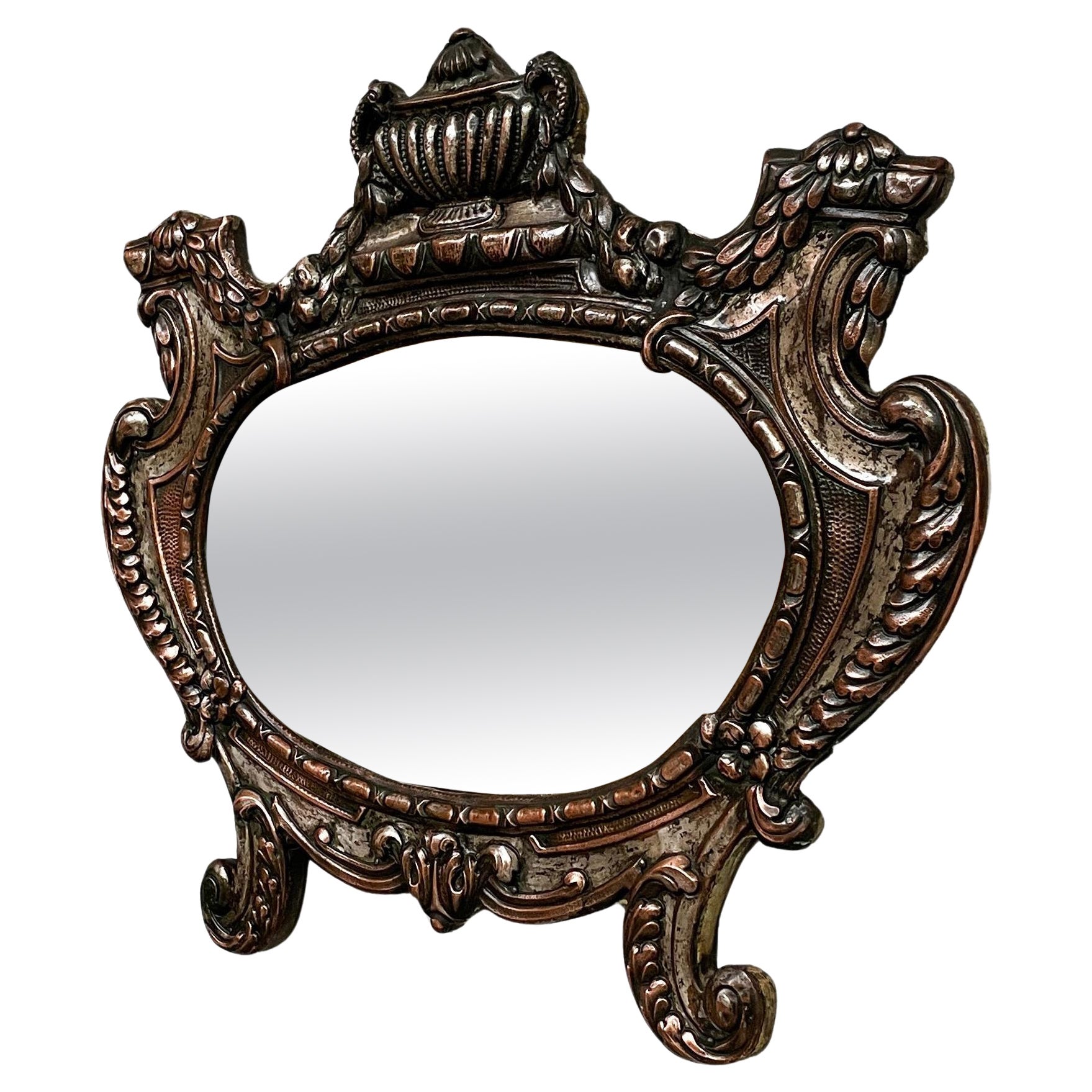 Italian finely crafted oval wall mirror in silvered copper, early 1900s