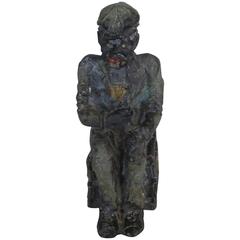 Antique Lead Figural of a Black Man on a Crate Drinking from a Bottle