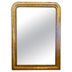 Grand miroir ancien de style Louis Philippe en or doré