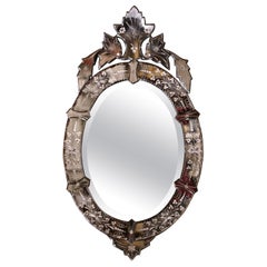 Miroir vénitien ovale biseauté italien du milieu du siècle dernier avec gravure florale peinte