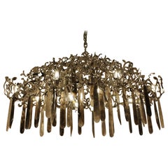 A unique hand made chandelier in nickel steel, smoked & clear rock crystal