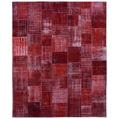 Roter überzogener Patchwork-Teppich in Rot