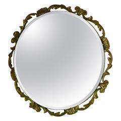Miroir mural rond Art Déco Atsonea orné de dorures