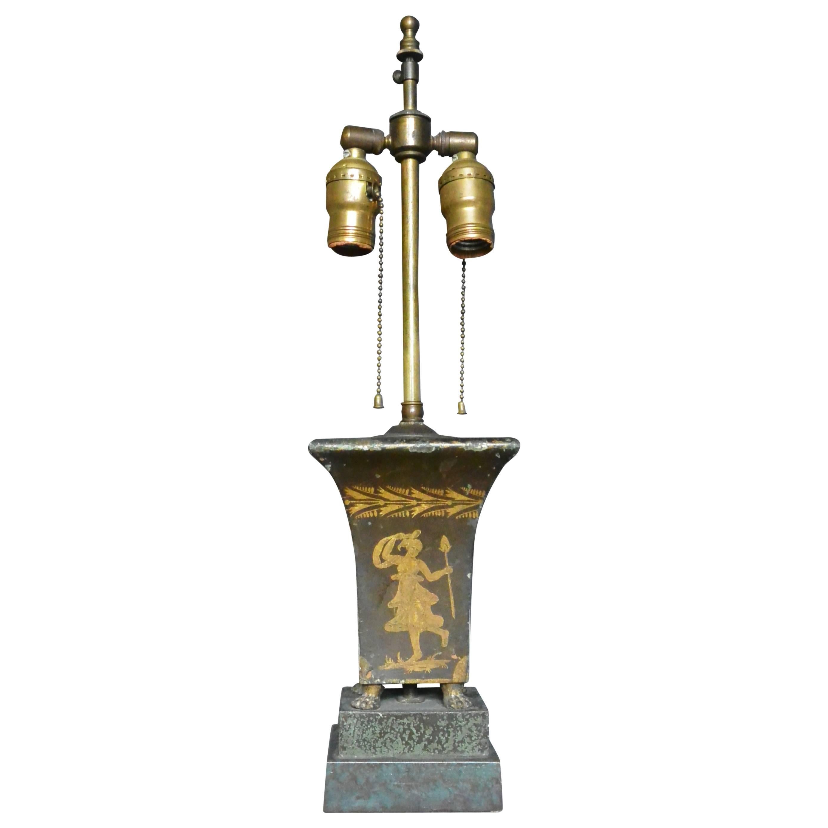 French tole jardiniere lamp.  Empire gilt painted brown tole jardiniere with paw feet on raised green faux marble platform, now converted to a lamp.  France, early 19th century. 
Dimension: 4.5