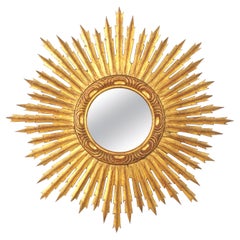Specchio spagnolo dorato a raggiera, legno intagliato, foglia d'oro