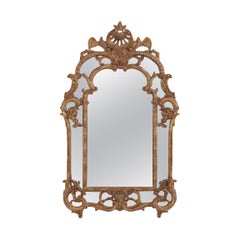A French Louis XV style carved and giltwood mirror C 1940.