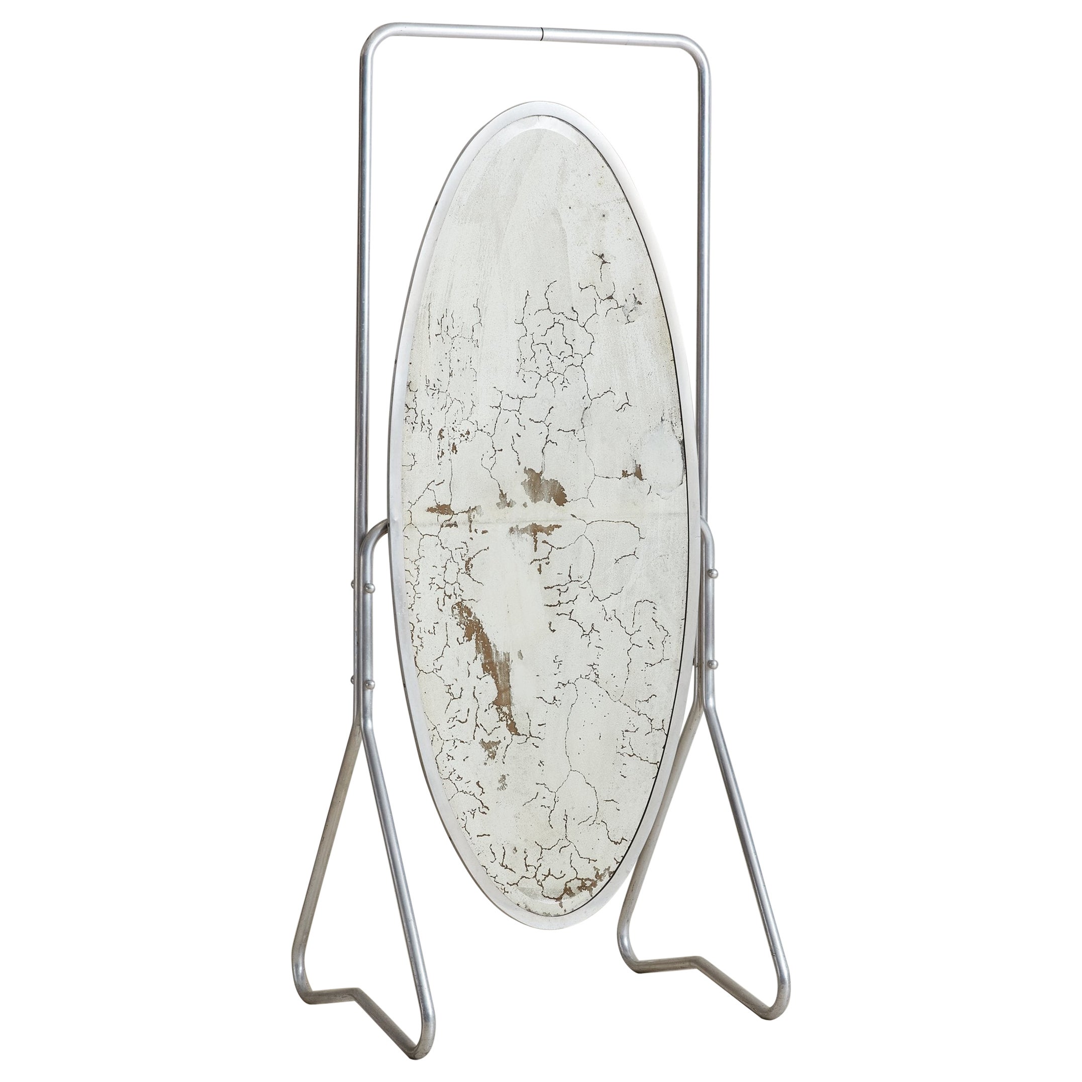 Miroir de sol autoportant en verre mercuré argenté antique, France, années 1930