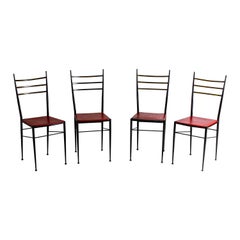 Fine set of metal dining chairs with red leather seating, Italy 1970s