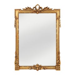 Highly decorated gilted carved wooden wall mirror, Belgium ca. 1950