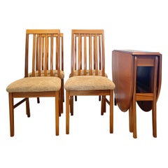 Vintage mid century modern dining set including a drop leaf table and 4 chairs
