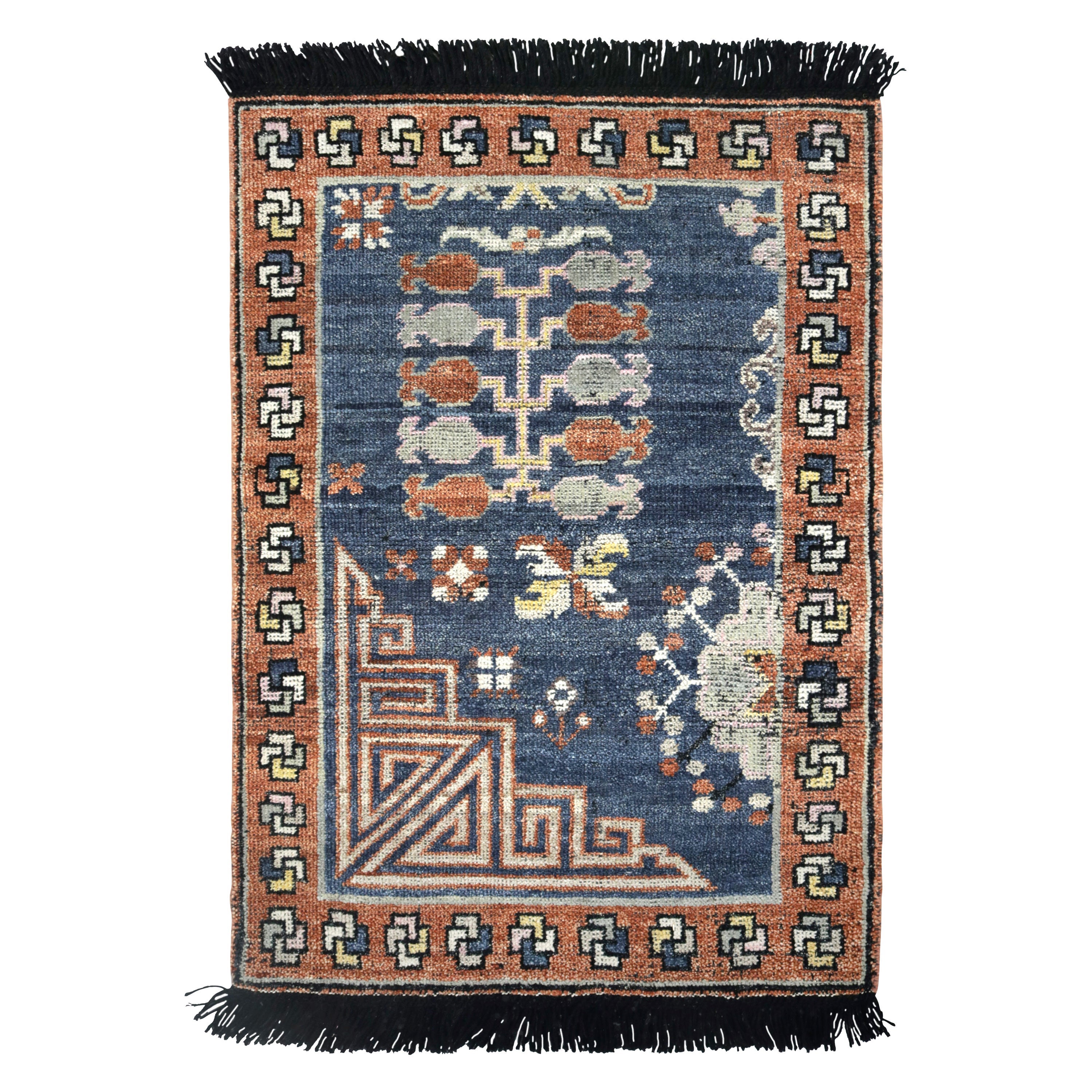 Rug & Kilim’s Khotan inspired rug in Brown & Blue Geometric Patterns