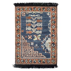 Rug & Kilim’s Khotan inspired rug in Brown & Blue Geometric Patterns