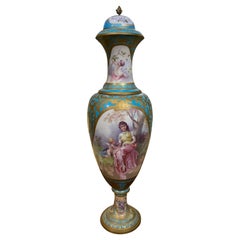 Sevres style 19 th c. Urn in Celeste blue, Hand painted in pastel hues