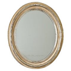 Miroir ovale français du 19ème siècle en argent doré